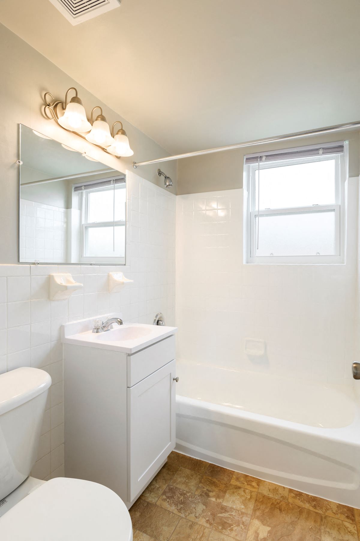 a bathroom with a sink toilet and a tub