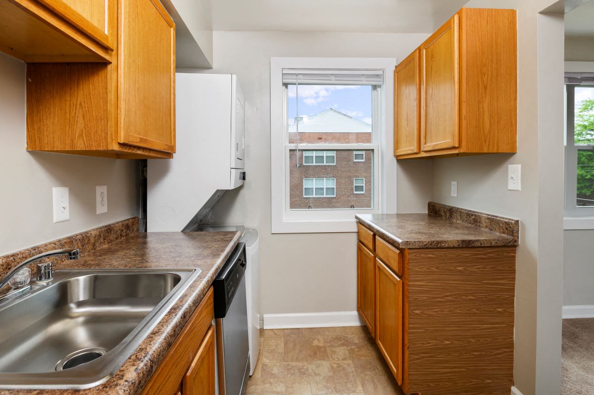 a kitchen with a sink and a window