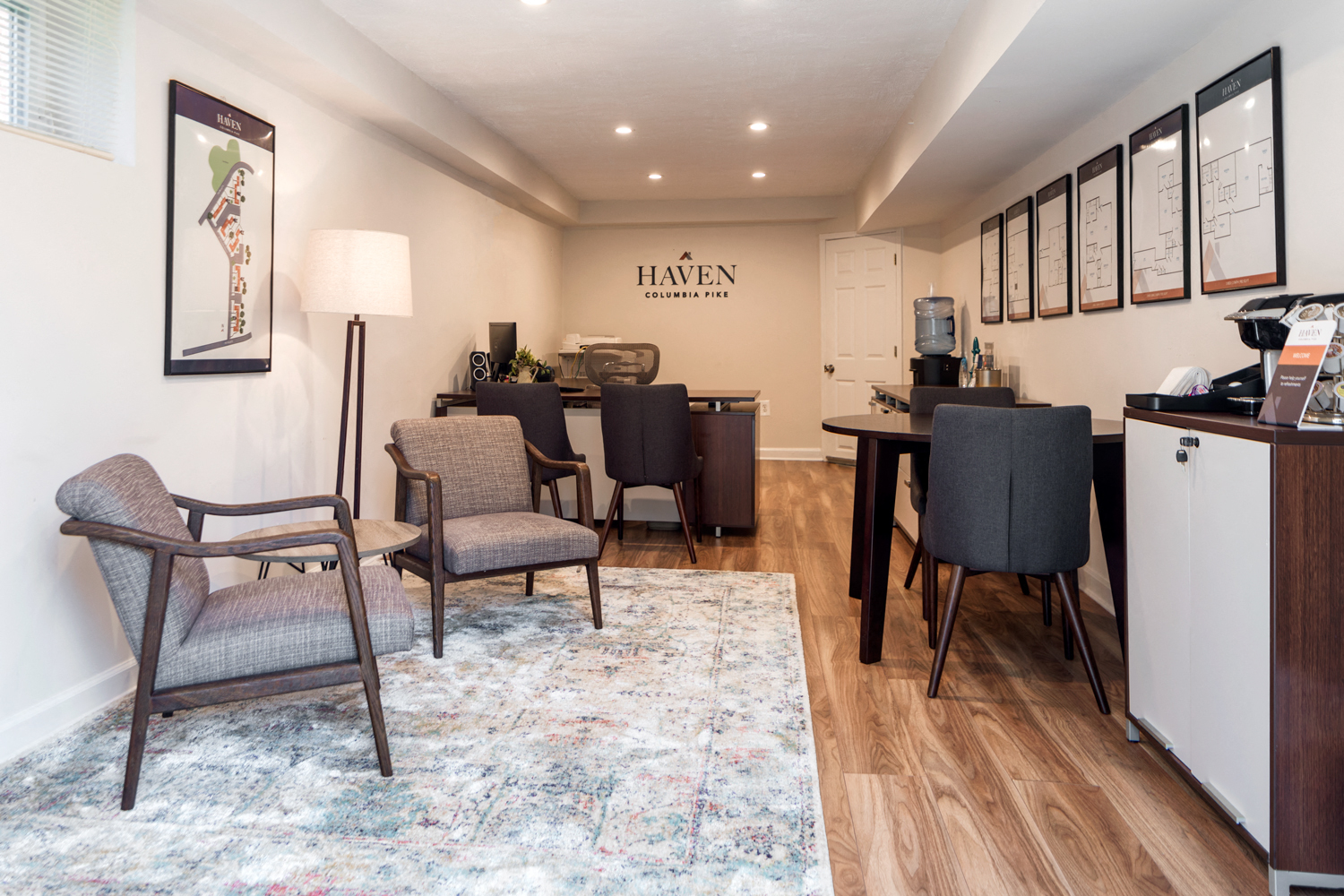 a living room and dining room with a table and chairs