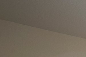 a bedroom with a large bed and a ceiling fan