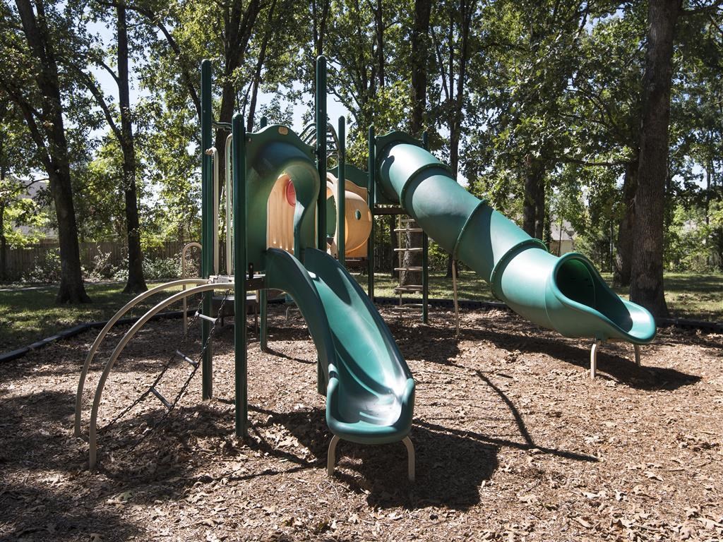 a playground with slides at a park