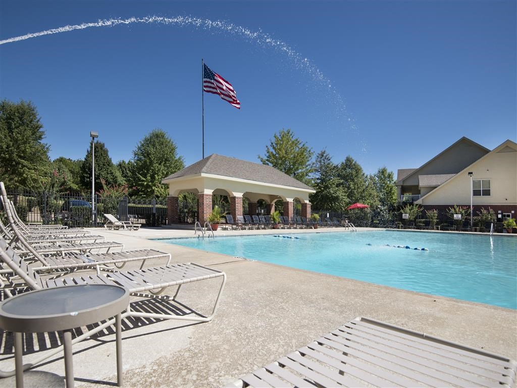 the swimming pool at the resort on a sunny day