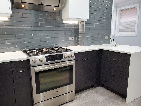 a kitchen with a stainless steel stove and