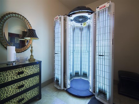 a shower in a bathroom with a glass door