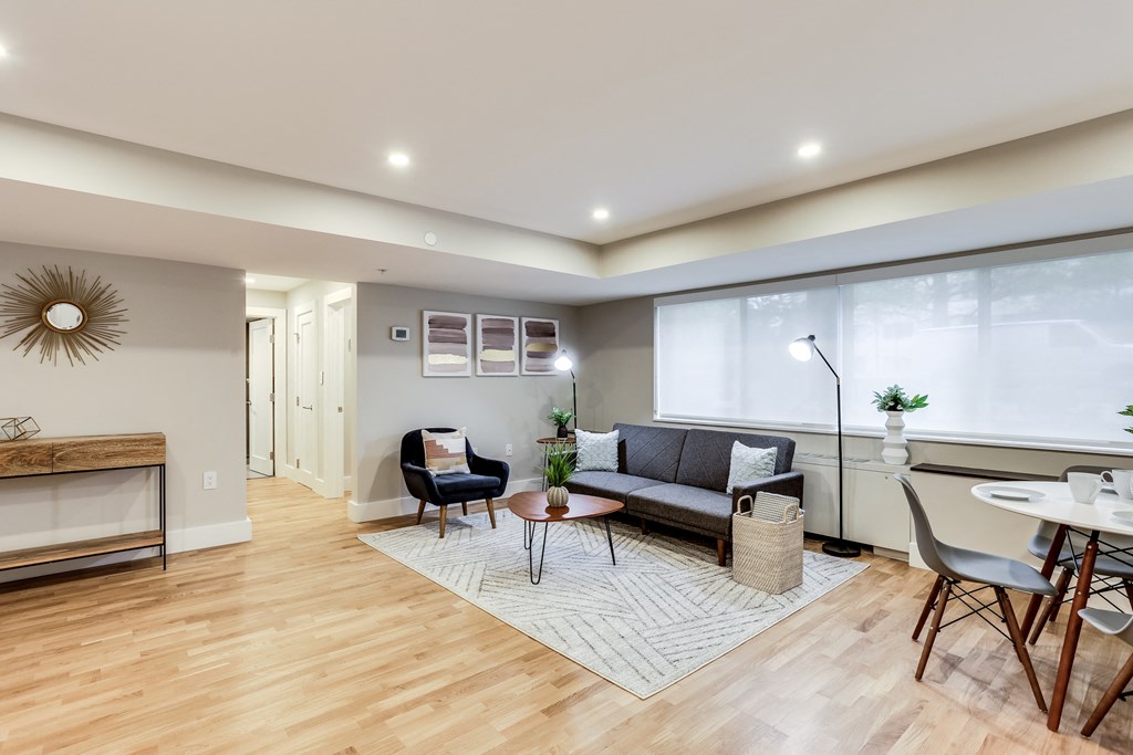 an open living room with a couch and a dining table