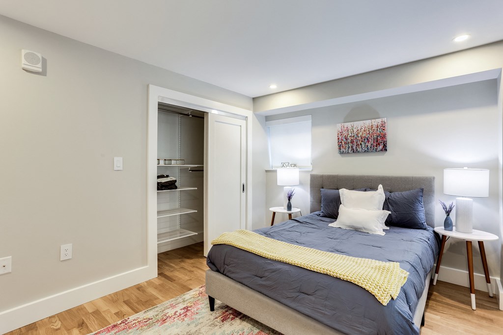 a bedroom with a bed and a closet