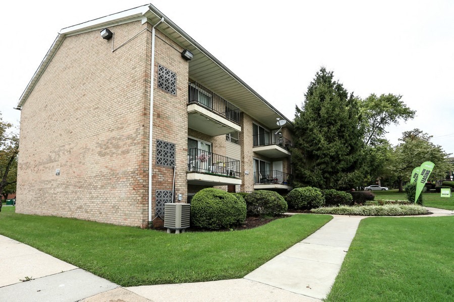 Pangea Pines Apartments in Baltimore, MD feature balconies and clean grounds.