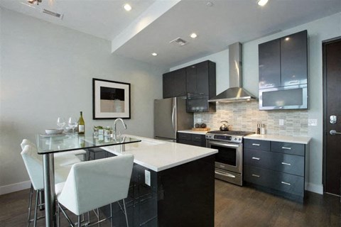 a kitchen with a counter and a table