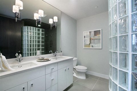 a bathroom with a sink and a toilet and a mirror