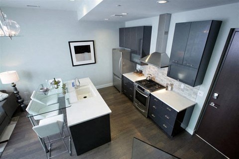 a kitchen and a dining room with a table