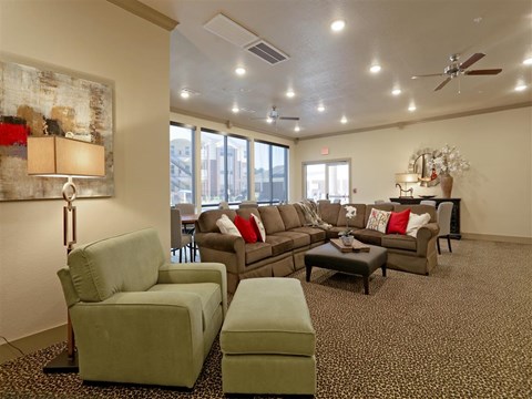 a living room with couches and chairs and a table