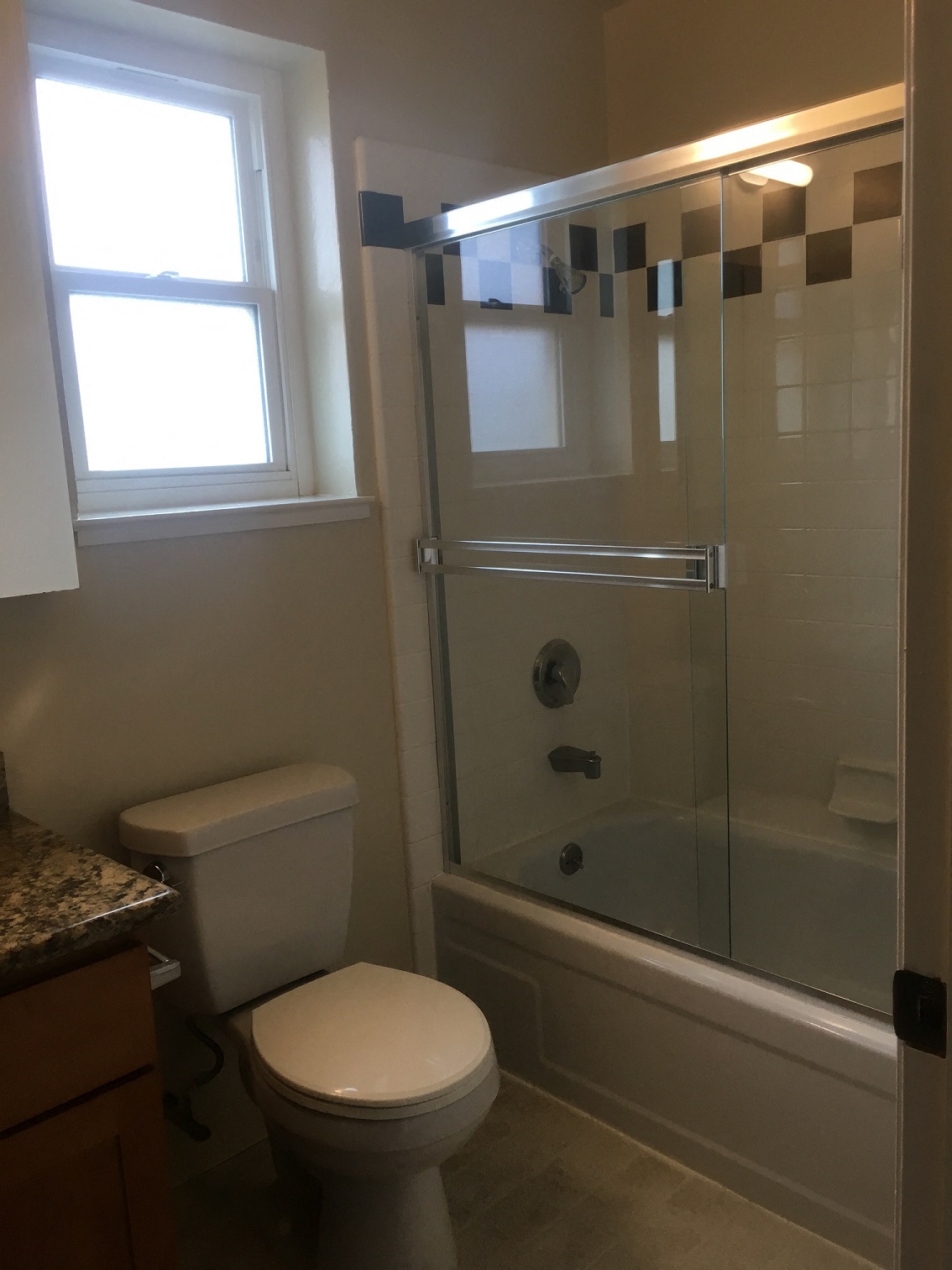 a small bathroom with a toilet and a shower