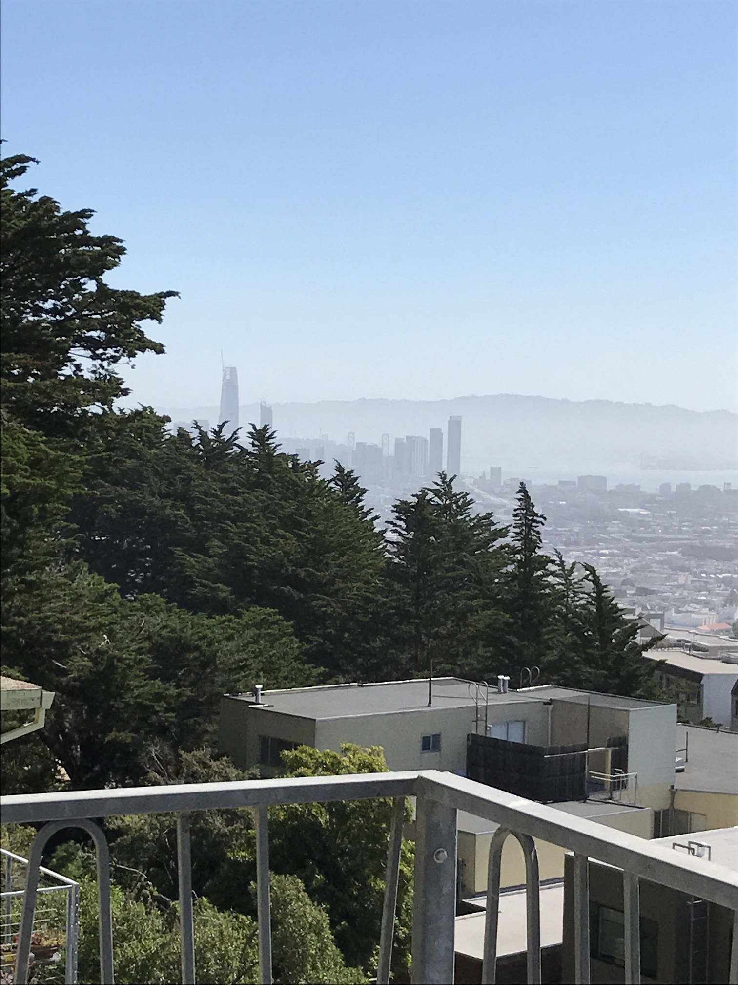 the city in the distance from a balcony