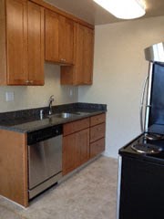 a kitchen with a stove and a sink