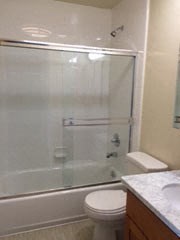 a bathroom with a toilet and a shower