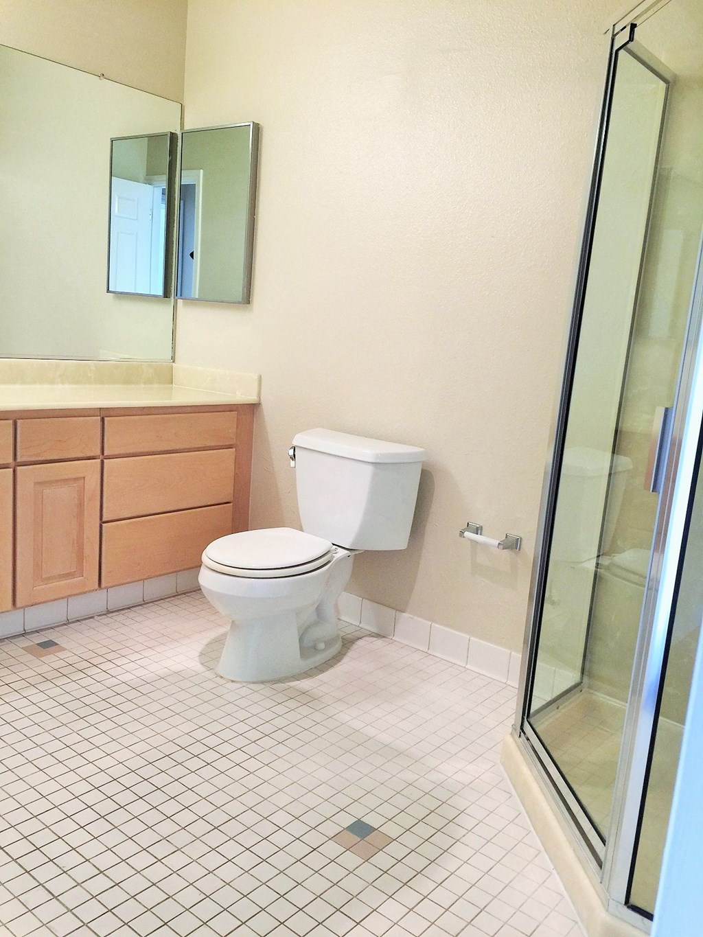 an empty bathroom with a toilet and a shower