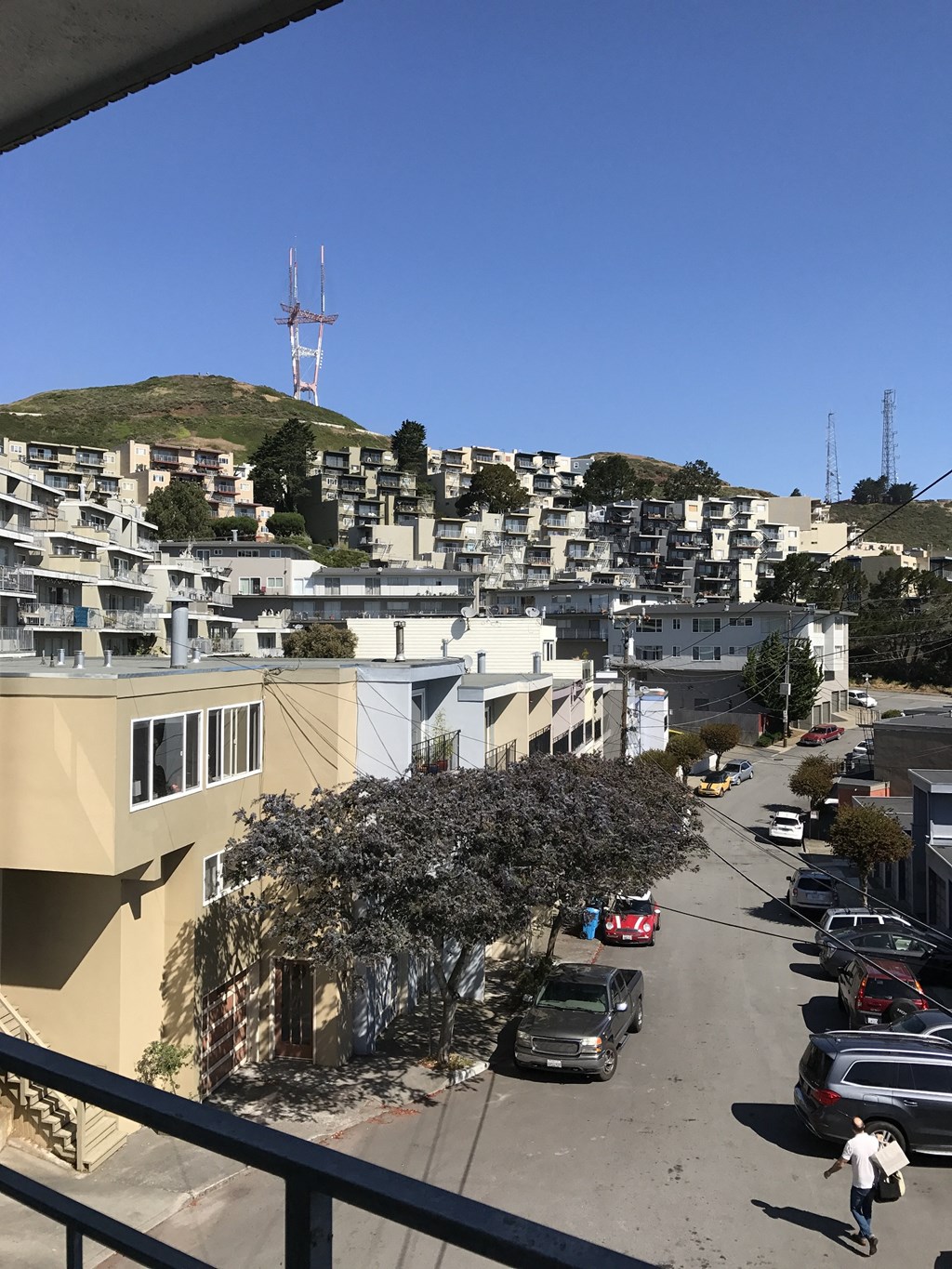 a view of the city from the balcony of a building