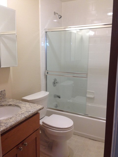 a small bathroom with a toilet and a shower