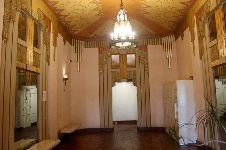 the lobby of a building with a chandelier