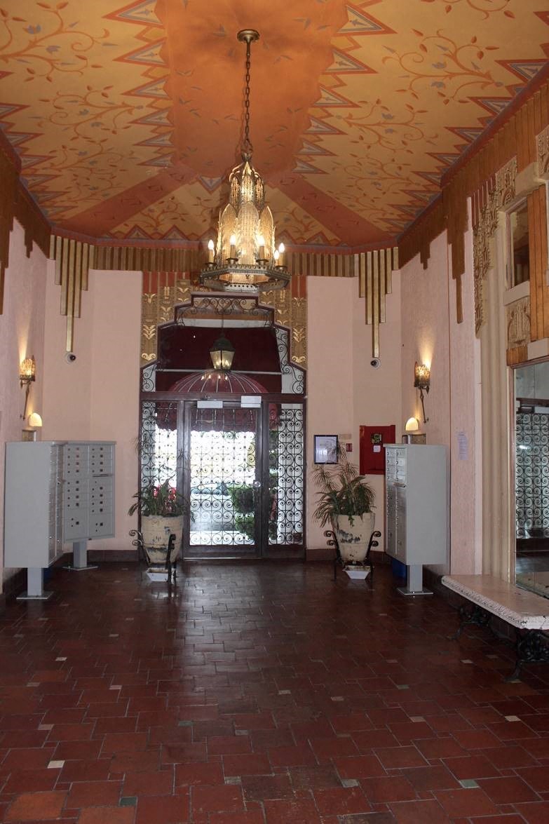 the lobby of a building with a chandelier
