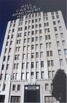 a tall building with a sign on top of it