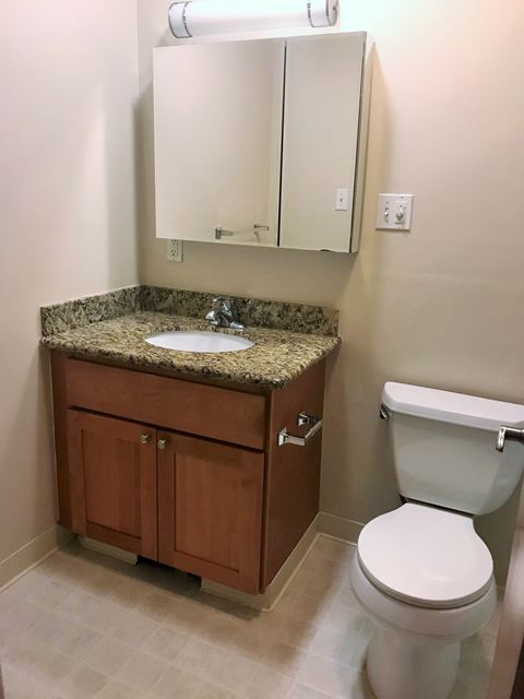 a small bathroom with a sink toilet and a mirror