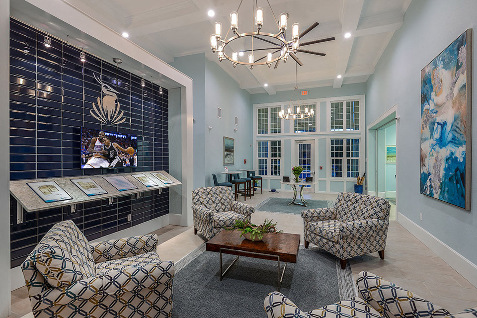 a living room with furniture and a chandelier