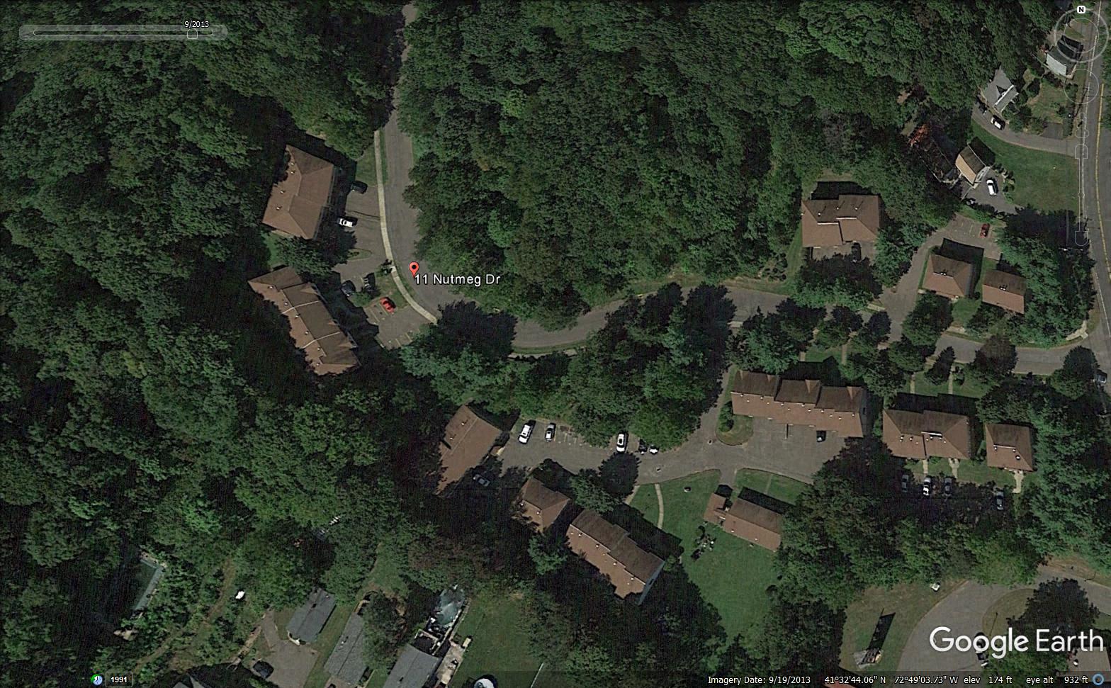 google earth view of a neighborhood with houses and trees