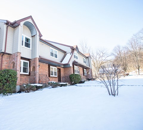 the front of the house in the snow