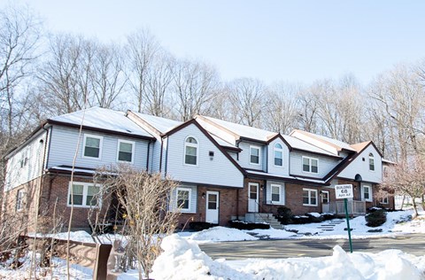a row of houses covered in snow