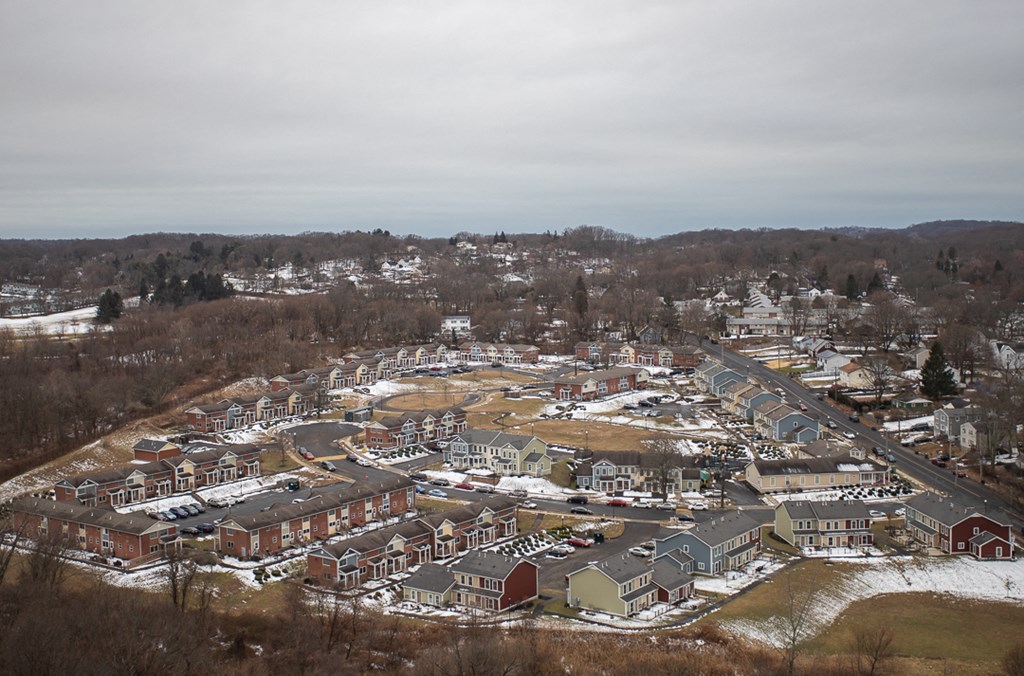 an aerial view of a city with snow on the ground
