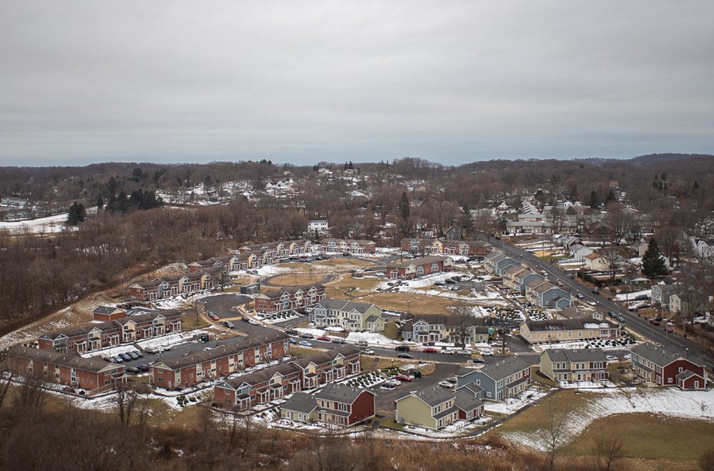 an aerial view of a city with snow on the ground
