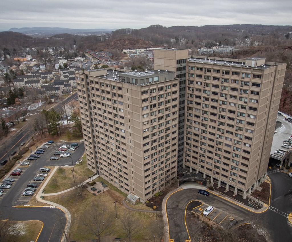 an aerial view of a tall building in a city