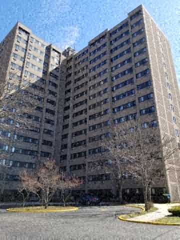 a tall building with a street in front of it