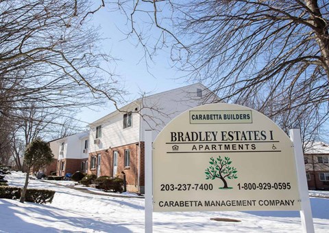 a sign estates i apartments in the snow