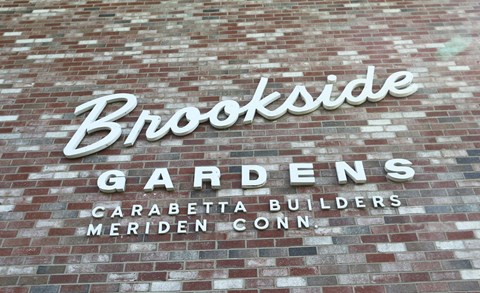 the sign on the side of a brick building
