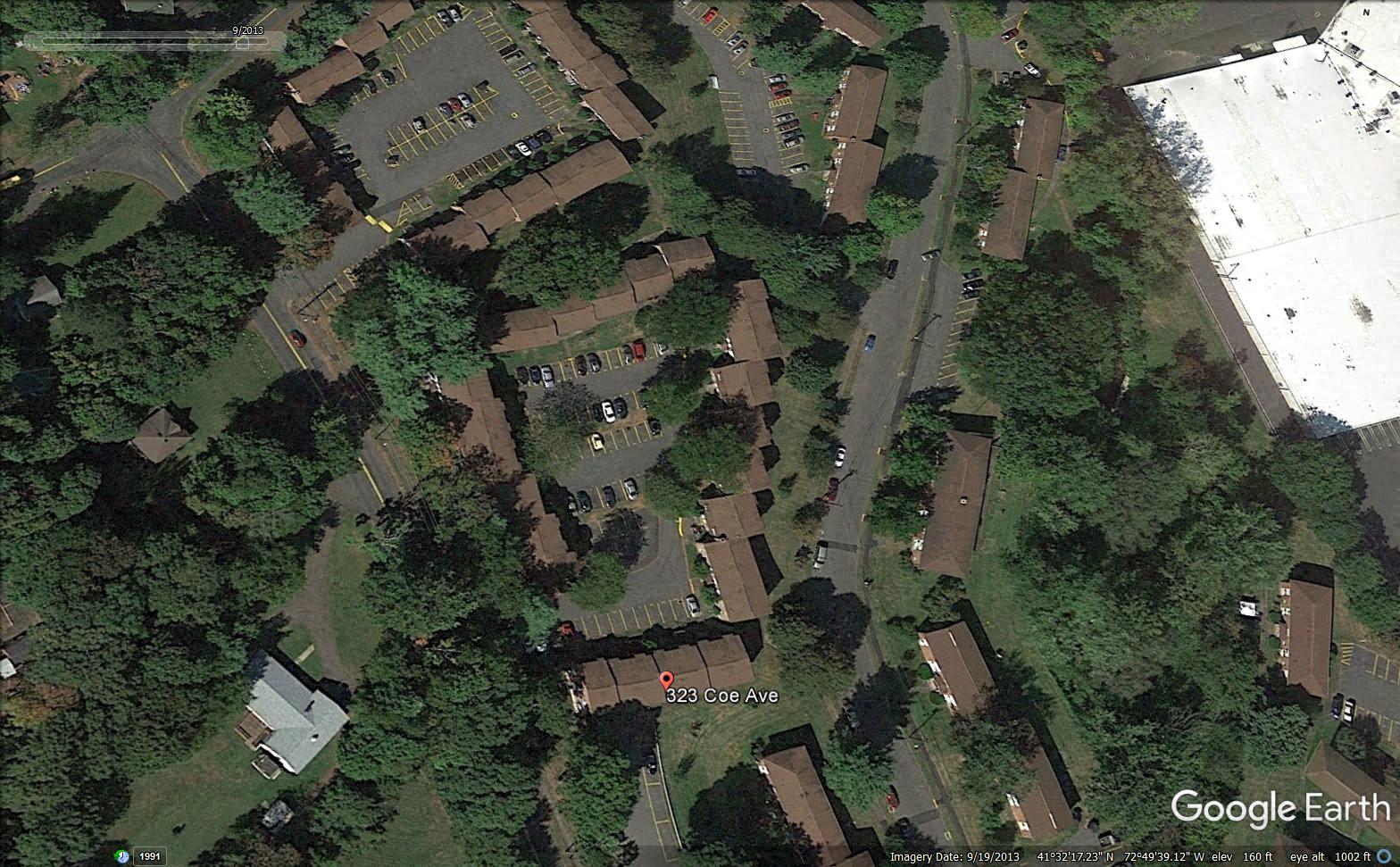 an aerial view of a neighborhood with houses and trees