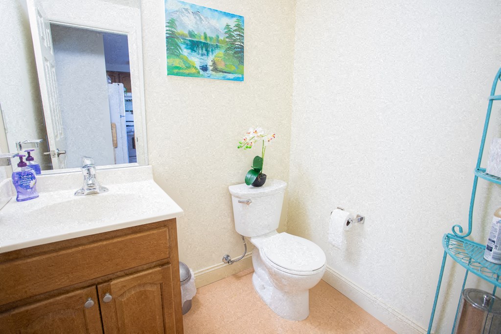 a bathroom with a toilet and a sink