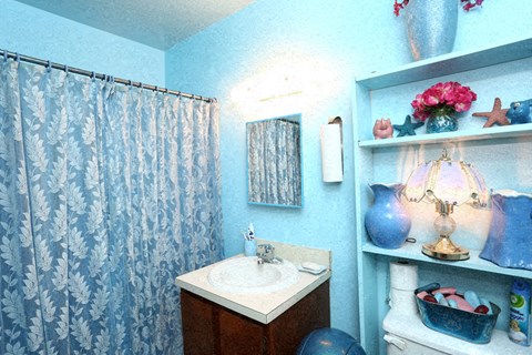 a bathroom with a white sink and a shower curtain