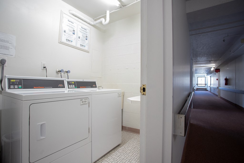 a laundry room with a washer and a dryer in it