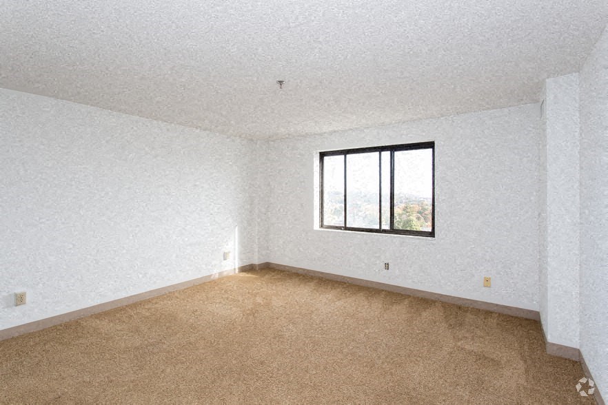 an empty room with a window in it