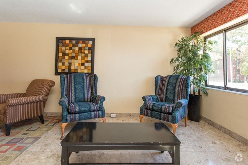 a living room with two chairs and a coffee table