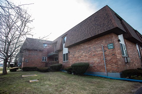 a view of the side of a brick house