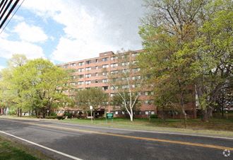 a large apartment building on the side of a street