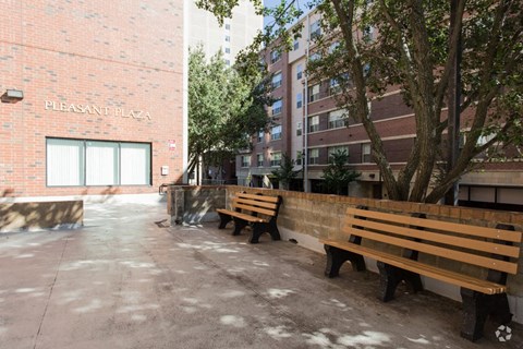 a group of benches in front of a building