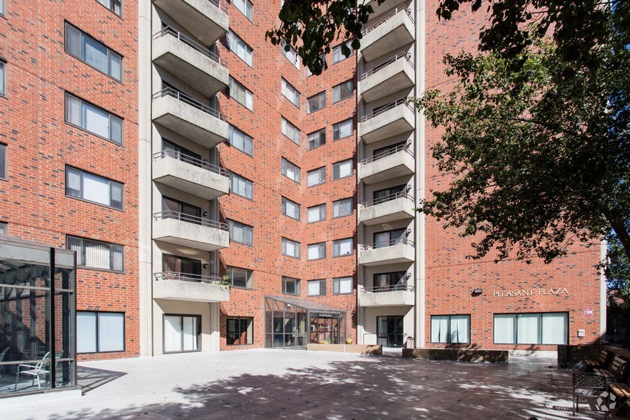 an empty street in front of an apartment building