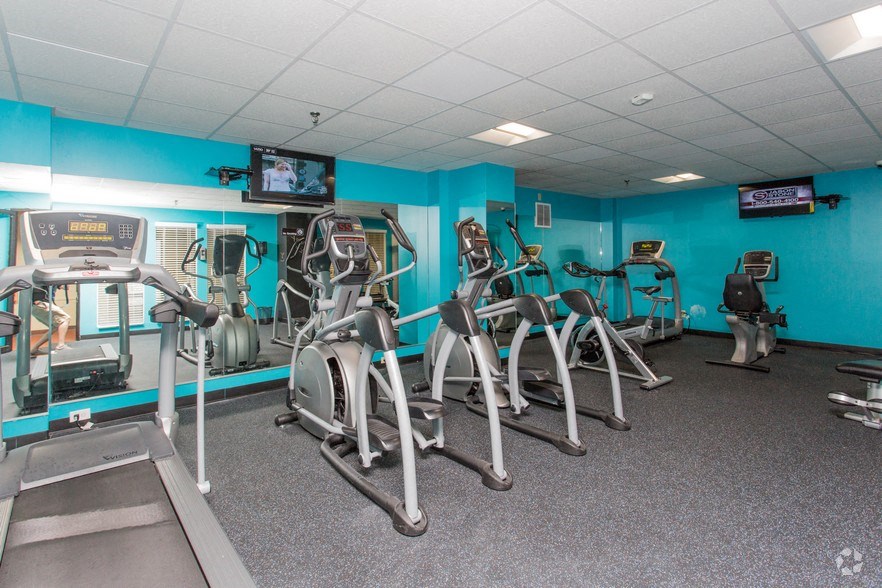 a gym with a lot of exercise equipment