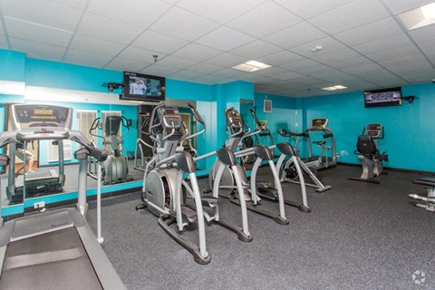 a gym with a lot of exercise equipment