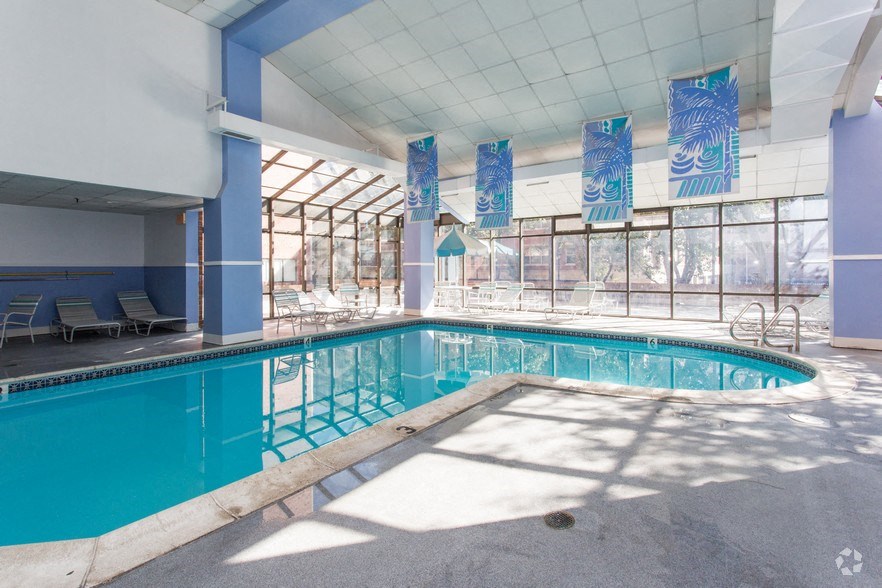 the swimming pool at or near aurora inn hotel and convention center