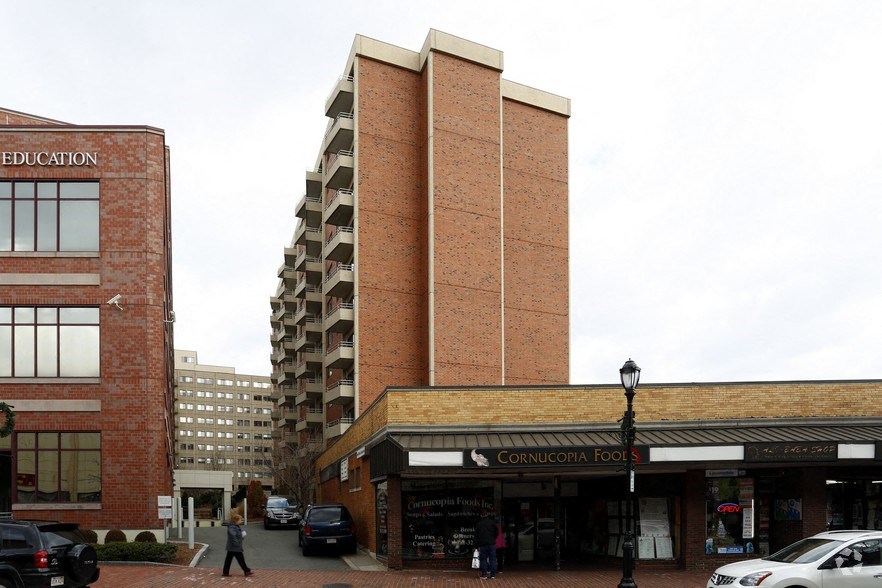 a large brick building on the corner of a city street